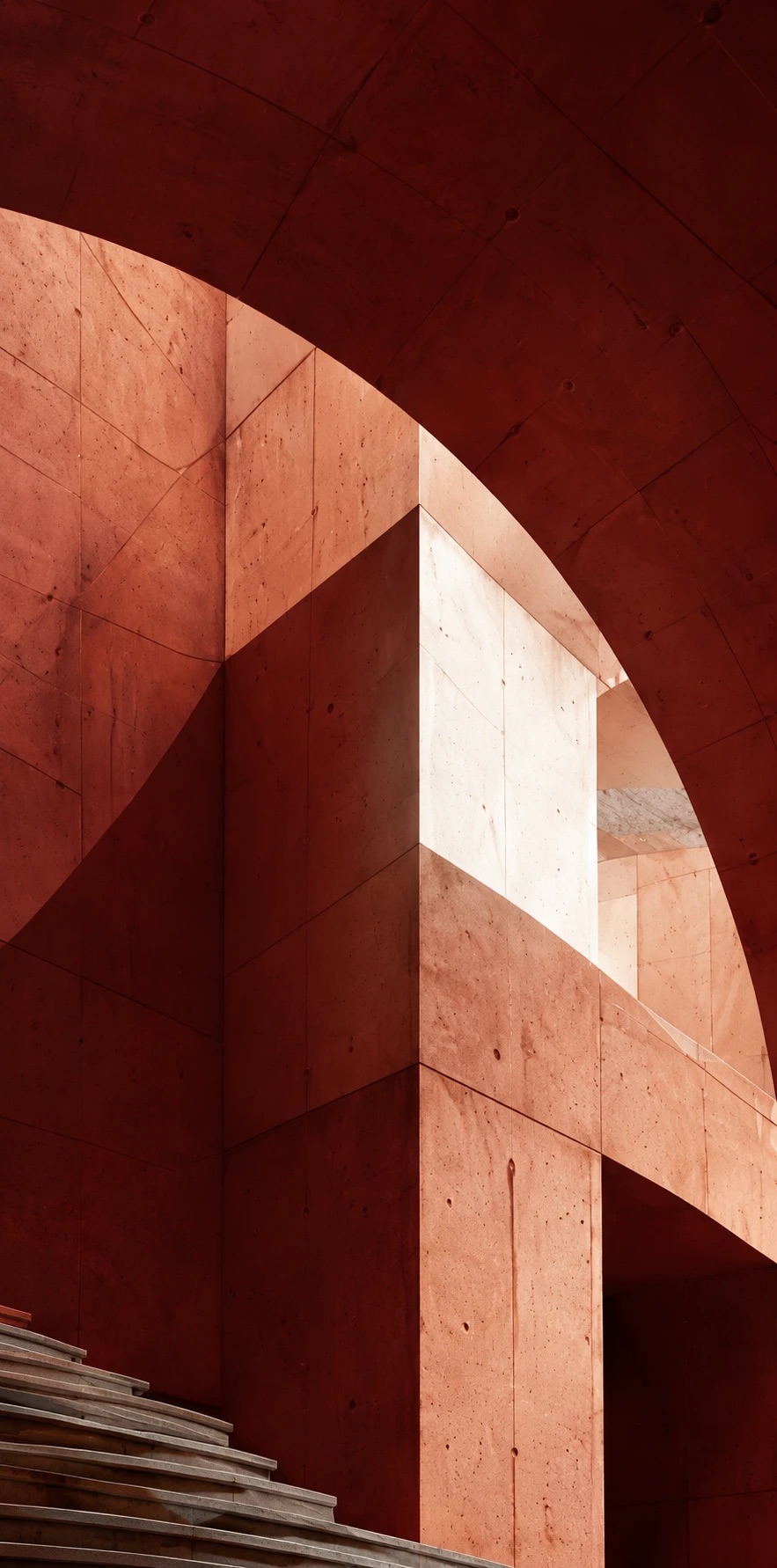 Ruang beton merah dengan cahaya geometris